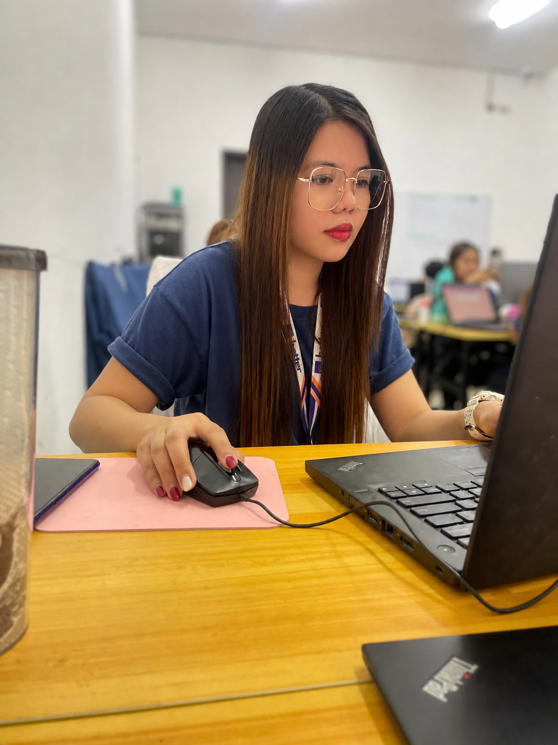 Crisia working at her desk